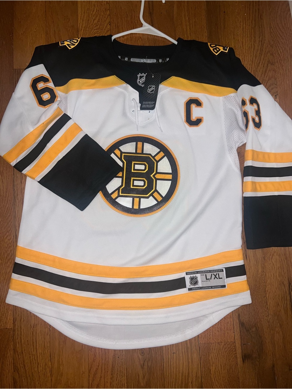 NHL Black White and Yellow Hockey Jersey with NHL Crest